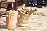 ximbomba with a basket of flabiols or reed pipes